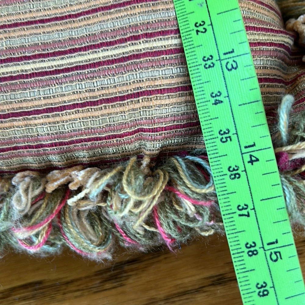 Striped gold/wine accent pillow with fringe.  Size is 14” x 18”